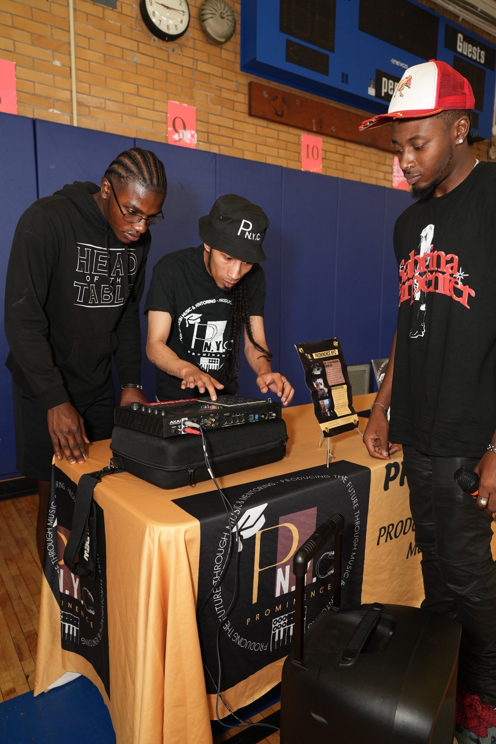 The Prominence NYC team demonstrating music-production equipment